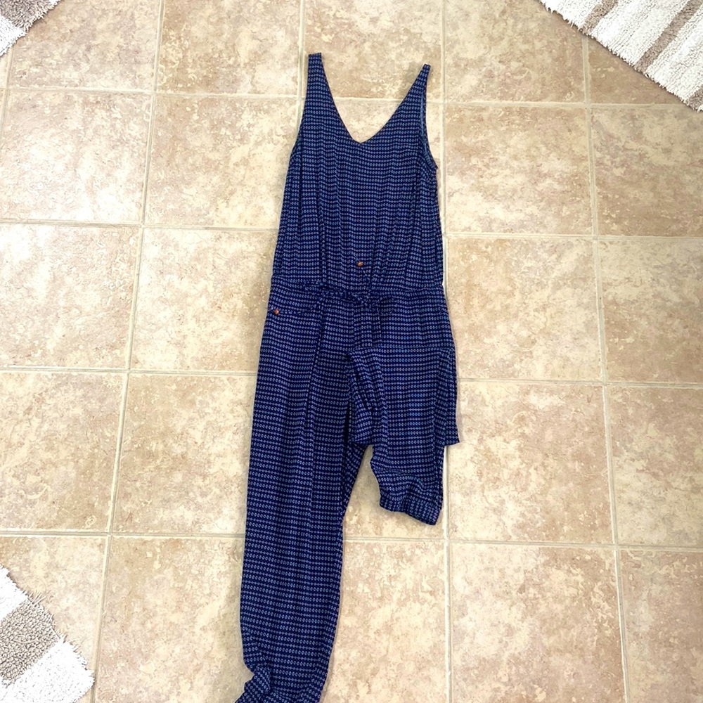 Navy Romper with white designs. Great condition. Elastic waist with tie.